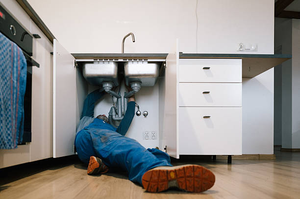 Professional Emergency Plumber technician working in Random Lake, WI